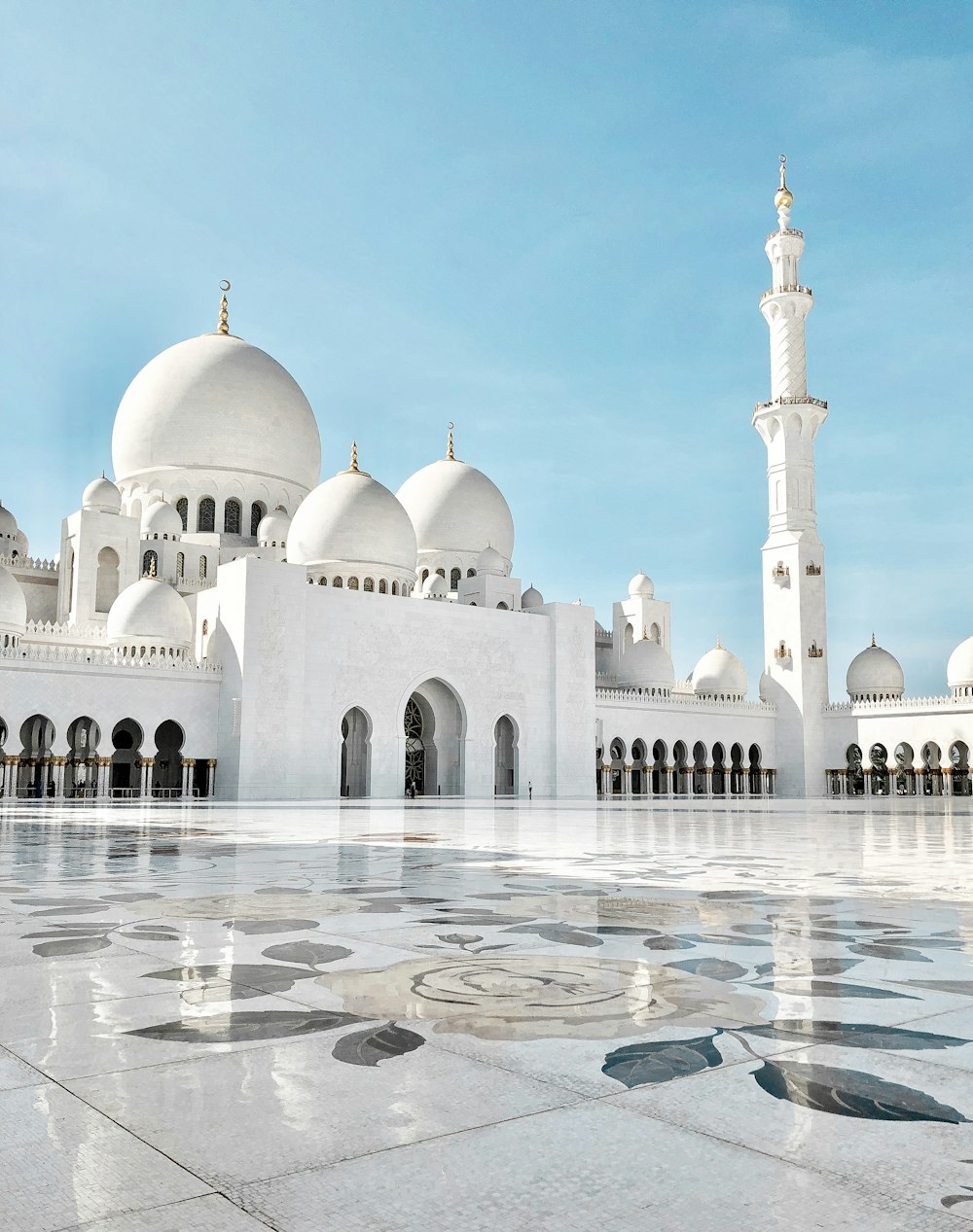White domes and minaret of a grand mosque